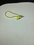 Manic yellow purse charm